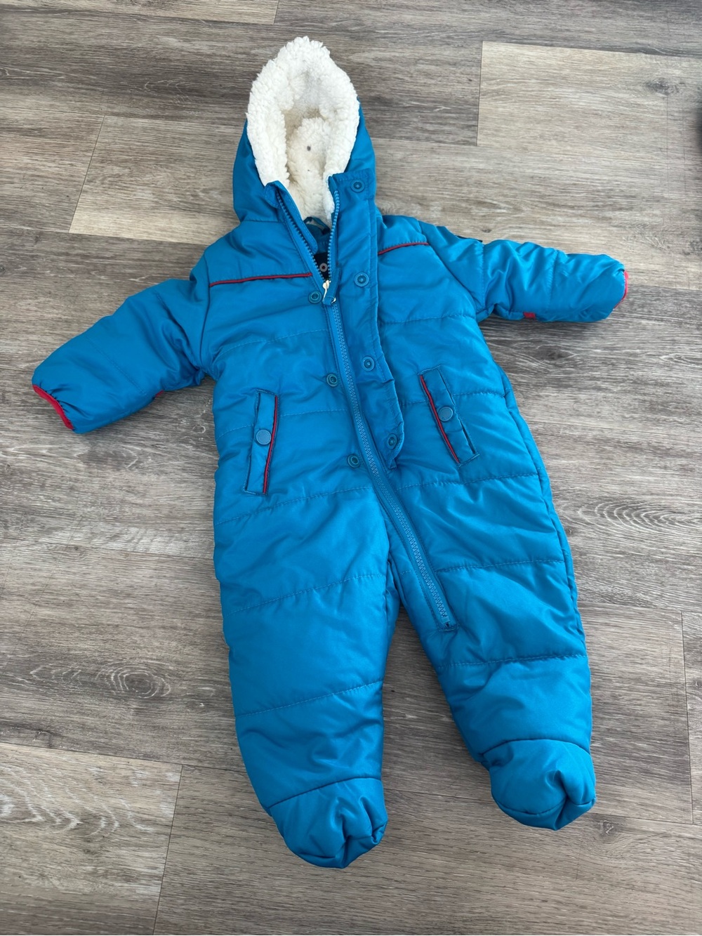 Ben Sherman Baby Boy Snowsuit featuring a white sherpa-lined hood and red accent
